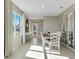 Bright dining room with large window, designer mirrors creating an open and airy ambiance at 2897 Elio Hammock Dr, St Cloud, FL 34773