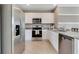 Well-equipped kitchen boasts stainless steel appliances, granite countertops, and ample cabinet space at 2897 Elio Hammock Dr, St Cloud, FL 34773