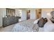 The bright main bedroom features a dresser, neutral walls, carpet and an ensuite at 2897 Elio Hammock Dr, St Cloud, FL 34773