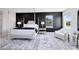 Modern bedroom with luxury bed, accent wall, and carpet at 300 Muirfield Loop, Reunion, FL 34747