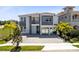 Stunning two-story home featuring a private balcony and a three-car garage at 300 Muirfield Loop, Reunion, FL 34747