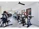 Spacious home gym filled with workout equipment, perfect for fitness enthusiasts at 300 Muirfield Loop, Reunion, FL 34747