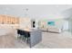 Bright living room with paneled wall design and open floor plan at 300 Muirfield Loop, Reunion, FL 34747