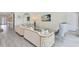 Elegant living room with plush seating, paneled walls, and modern decor at 300 Muirfield Loop, Reunion, FL 34747