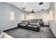 Home theater room with luxurious seating and a projector for immersive entertainment at 300 Muirfield Loop, Reunion, FL 34747