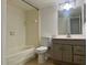 Neutral bathroom with a tiled shower/tub, neutral vanity with a bright mirror, and tiled floors at 315 Lakepointe Dr # 101, Altamonte Springs, FL 32701