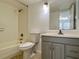 Neutral bathroom with a tiled shower/tub, neutral vanity with a bright mirror, and tiled floors at 315 Lakepointe Dr # 101, Altamonte Springs, FL 32701