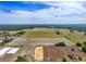 Property aerial view featuring open fields and green trees, offering a glimpse into the property's layout at 35651 Huff Rd, Eustis, FL 32736