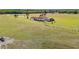 Aerial view showcasing the home's spacious, fenced property, lush landscaping, and serene, countryside setting at 35651 Huff Rd, Eustis, FL 32736