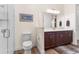 Bathroom features white cabinets, a large mirror, and a tiled shower stall at 35651 Huff Rd, Eustis, FL 32736