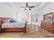 Bedroom showcasing tray ceilings, tile floors, and French doors at 35651 Huff Rd, Eustis, FL 32736