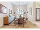 Dining room with wood-look tile flooring and a modern chandelier at 35651 Huff Rd, Eustis, FL 32736