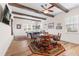 Spacious game room with pool table and dining area, hardwood floors and beams at 35651 Huff Rd, Eustis, FL 32736