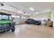 Spacious garage with a durable epoxy floor, two vehicles, and room for storage and projects at 35651 Huff Rd, Eustis, FL 32736