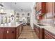 Well-appointed kitchen featuring an expansive island and stainless steel appliances, connecting seamlessly to the breakfast nook at 35651 Huff Rd, Eustis, FL 32736