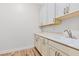 Bright utility room features ample cabinetry, countertop space and a sink, providing a functional space at 35651 Huff Rd, Eustis, FL 32736