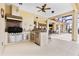 Outdoor kitchen featuring stainless steel appliances, a granite countertop, and grill for outdoor cooking and entertaining at 35651 Huff Rd, Eustis, FL 32736