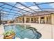 Gorgeous screened-in pool featuring ample seating and outdoor dining areas for relaxing and entertaining at 35651 Huff Rd, Eustis, FL 32736