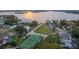 This luxurious home features a private tennis court and access to a community park with lake views at 4265 Conway Place Cir, Orlando, FL 32812