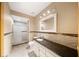 Elegant bathroom featuring a marble vanity, shower with glass doors, and decorative wall accent at 4265 Conway Place Cir, Orlando, FL 32812