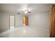 Spacious bedroom featuring tile flooring, a ceiling fan, and closet, offering comfort and practicality at 4265 Conway Place Cir, Orlando, FL 32812