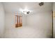 Bright bedroom with tile flooring, ceiling fan, and window with elegant, amber-tone draperies at 4265 Conway Place Cir, Orlando, FL 32812