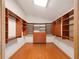Walk-in closet with wood floors and shelving at 4265 Conway Place Cir, Orlando, FL 32812