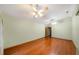Living room featuring wood floors and ceiling fans at 4265 Conway Place Cir, Orlando, FL 32812