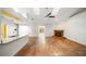 Open living room with tile flooring, fireplace, high ceilings, and bright natural light at 4265 Conway Place Cir, Orlando, FL 32812