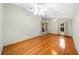 Spacious living room with hardwood floors and a view of the bathroom at 4265 Conway Place Cir, Orlando, FL 32812