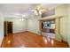 Living room featuring hardwood floors and a view of the bathroom at 4265 Conway Place Cir, Orlando, FL 32812
