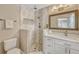 This bathroom has neutral walls, a stone floor shower, white vanity and stainless steel hardware at 502 Oak Ln, Maitland, FL 32751