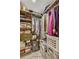 A walk-in closet contains racks, shelves, and storage bins to maximize its organizational potential at 502 Oak Ln, Maitland, FL 32751