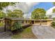 Charming single-story home with a well-manicured lawn and an inviting driveway at 502 Oak Ln, Maitland, FL 32751