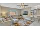 Cozy living room featuring a decorative rug, comfortable seating, and natural light from a large window at 502 Oak Ln, Maitland, FL 32751