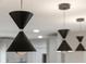 View of kitchen pendant lighting, featuring three black and chrome modern hanging lights above the kitchen island at 502 Oak Ln, Maitland, FL 32751
