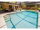Backyard pool featuring steps to enter and a patio with dining area adjacent to the house at 502 Oak Ln, Maitland, FL 32751