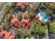 Aerial view of townhomes with community pool surrounded by mature trees at 546 Via Fontana Dr # 203, Altamonte Springs, FL 32714