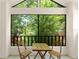 Outdoor balcony features a table and chairs with beautiful treetop views at 546 Via Fontana Dr # 203, Altamonte Springs, FL 32714
