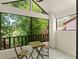 Cozy balcony with seating and views of lush trees, perfect for relaxation at 546 Via Fontana Dr # 203, Altamonte Springs, FL 32714