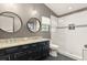 Bathroom with double vanity, sleek mirrors, and a glass-enclosed shower with a tiled surround at 546 Via Fontana Dr # 203, Altamonte Springs, FL 32714