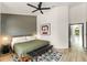 Stylish bedroom features wood floors, a modern ceiling fan, and a gray accent wall at 546 Via Fontana Dr # 203, Altamonte Springs, FL 32714