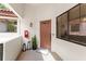 Charming entryway features a stylish door, potted plants, and decorative lanterns at 546 Via Fontana Dr # 203, Altamonte Springs, FL 32714