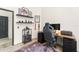 Well-appointed office space includes a large desk, wall shelves, and a comfortable chair at 546 Via Fontana Dr # 203, Altamonte Springs, FL 32714