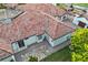 Aerial view shows the tile roof, brick driveway, and manicured landscaping of this stunning home at 5909 Oxford Moor Blvd, Windermere, FL 34786