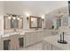 Luxurious bathroom featuring vanity with framed mirror, and a chandelier adding a touch of elegance at 5909 Oxford Moor Blvd, Windermere, FL 34786