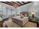 Spacious primary bedroom with hardwood floors, a chandelier, and ample natural light at 5909 Oxford Moor Blvd, Windermere, FL 34786