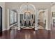 Formal dining room boasting elegant chandelier, arched entryway, and designer tile at 5909 Oxford Moor Blvd, Windermere, FL 34786