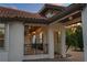 Elegant exterior features decorative iron railings, pendant lighting, and brick driveway and walkway at 5909 Oxford Moor Blvd, Windermere, FL 34786