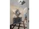Elegant hallway with tile floors, decorative cabinet and an arched doorway at 5909 Oxford Moor Blvd, Windermere, FL 34786